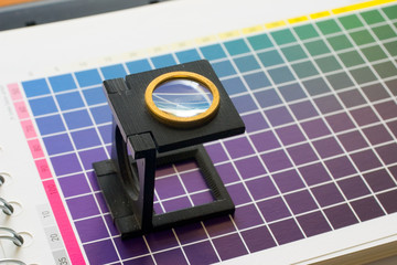 table of colour with magnifier lens