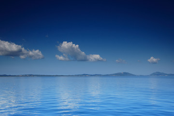Obraz premium view of an open sea with a cloud on corfu island