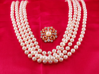 pearl strands and pin
