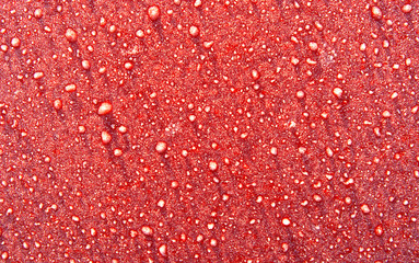 abstract morning frost on a red metal surface back