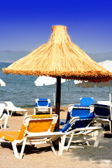 sun loungers by the beach on a mediterranean coast