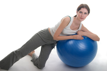 Fototapeta na wymiar woman leaning on exercise ball