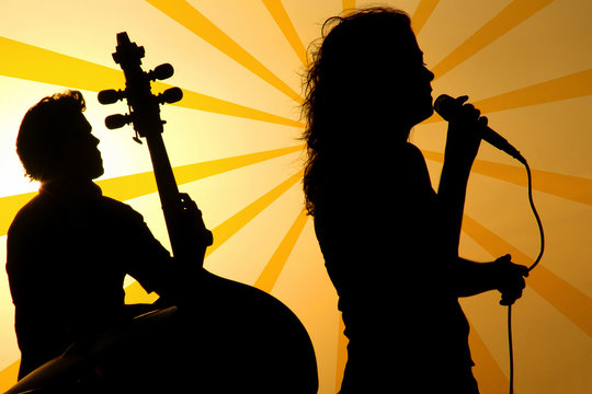 a singer and a stand up base silhouette