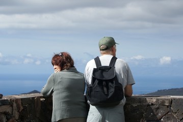 tourists overlooking the clouds