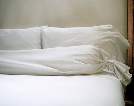 pillows against bed headboard