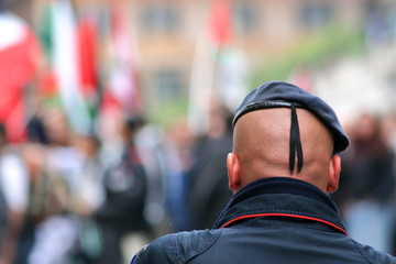 bald police officer in beret
