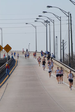 runners down the bridge