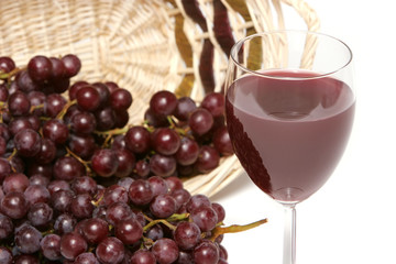 red grapes and wine in the glass