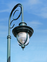 Fototapeta na wymiar fancy street lamp against blue sky