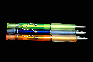 three colourful pens