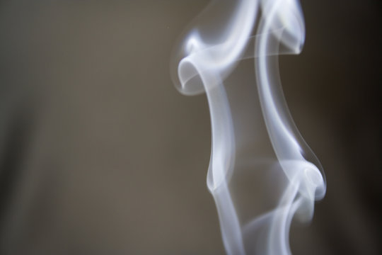 puff of aroma smoke on a dark background