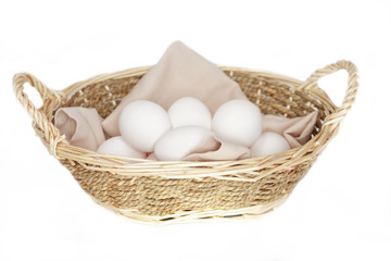 Fototapeta na wymiar white eggs in basket isolated