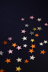 Fototapeta premium confetti on a black background