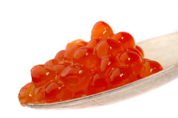 red caviar on the spoon, on a white background