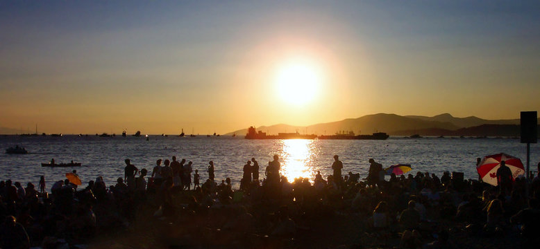 crowd and sunset at the beach