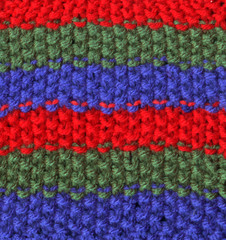 red, green and blue multicolored knitted wool.