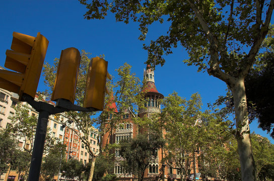 house with spires in barcelona city and traffic lights
