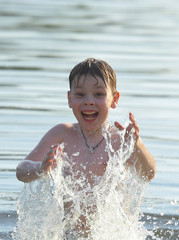 the boy bathes in water.