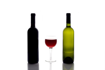 bottles of wine and a wine glass