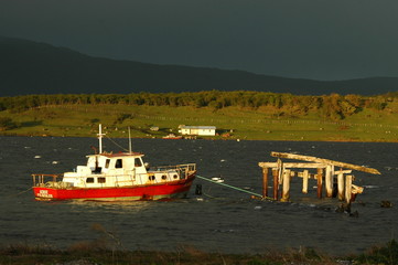 puerto natales boat in stormy weather