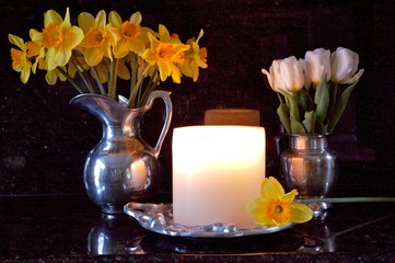 daffodills and  white tulips in candlelight