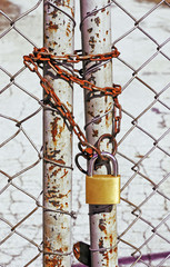 wire fence with a chain and a lock