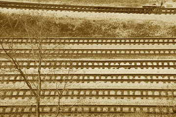 multiple railroad tracks in sepia