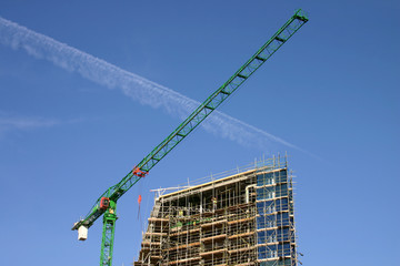 a crane and a building construction