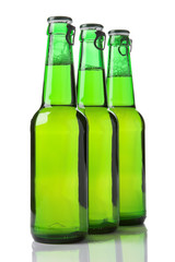 three green beer bottles