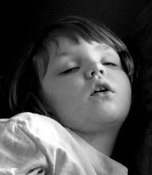 baby sleeping in black and white
