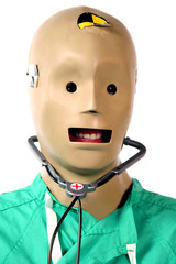 close-up of crash test dummy in doctors scrubs