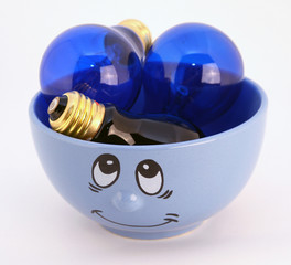 emotional happy bowl with blue light bulbs in it on white backgr
