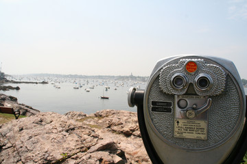 coin operated binoculars with beach in background