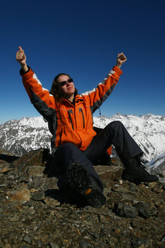 young sportswomen glad because of mountaineering