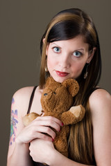 pretty brunette girl with teddy bear