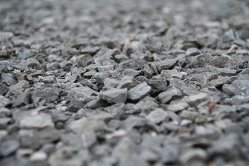 grey gravel close-up with jagged rough and rock te