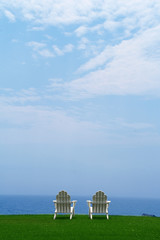 two chairs looking over an amazing ocean view on a