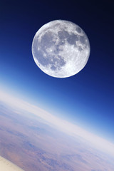 full moon over earth's stratosphere