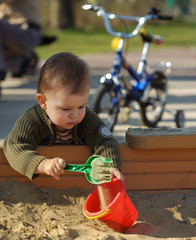 playing in the sand pit