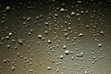 metal surface covered with water drops after rain