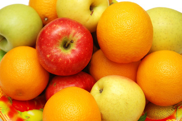 oranges and apples assorted in the tray