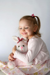 baby girl and pink bunny