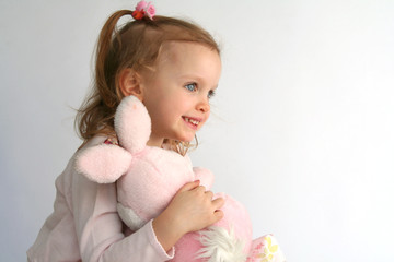 baby girl and pink bunny