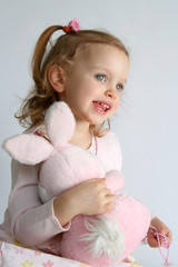 baby girl and pink bunny