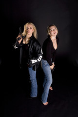 Fototapeta na wymiar two woman with guns