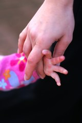 child girl and mother hands