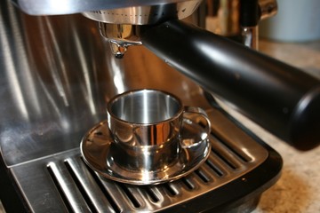 chrome coffee machine and cup