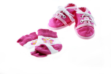 pink baby shoes and socks isolated