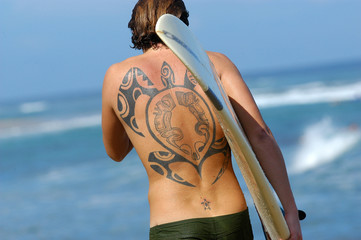 tattooed surfer