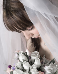 bridal portrait looking down at bouquet